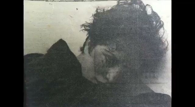 Faded family photograph of a woman resting